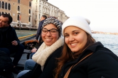 Riding a gondola in Venice